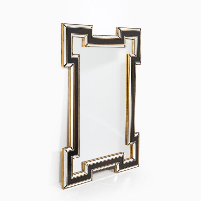 This Mid-Century Modernist mirror, crafted in America circa 1960, is a stunning example of bold, geometric design inspired...