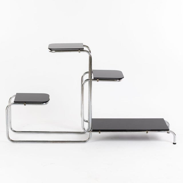 Chrome-plated steel tube. Black glass plates (original condition) signs of wear, scratches