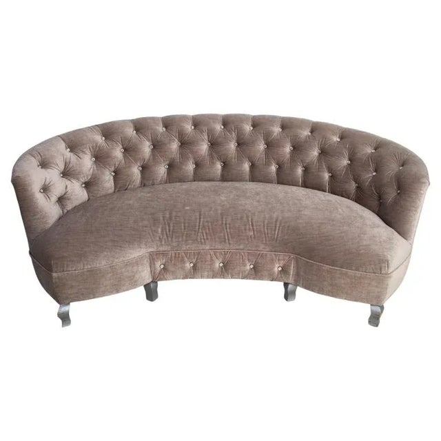Modern Hollywood Regency Style Button-Tufted Grey Velvet Upholstered Crescent Sofa, raised on cabriole silvered wood feet....