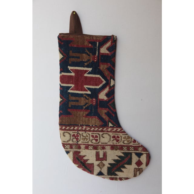 Celebrate the season with this one-of a kind Christmas stocking, handcrafted from a genuine antique tribal rug. Rich in...