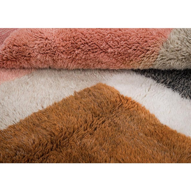 Bold hand-knotted wool rug showcasing an abstract geometric pattern in rich shades of Honey Ginger, Light Taupe, Burnt...