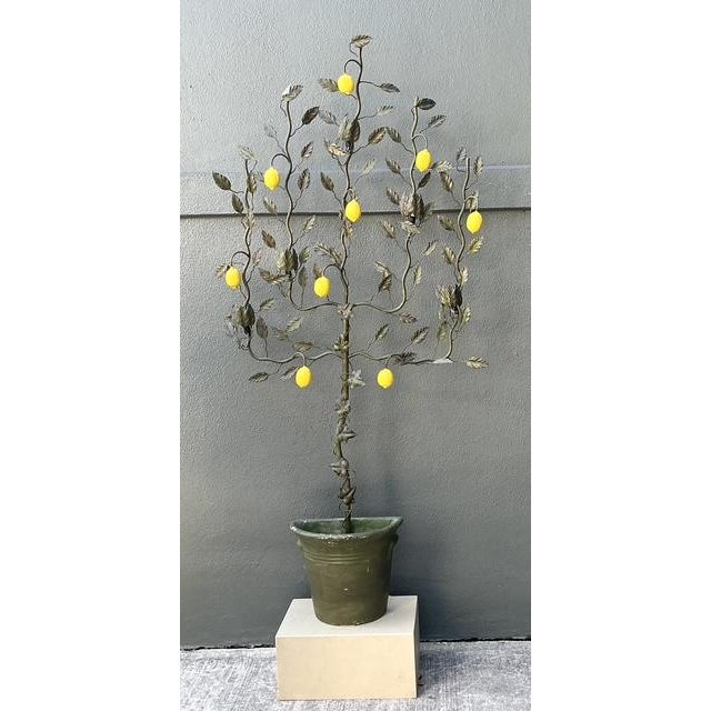 Transform your living space into a sun-drenched Mediterranean villa with this rare pair of vintage Italian lemon tole tree...