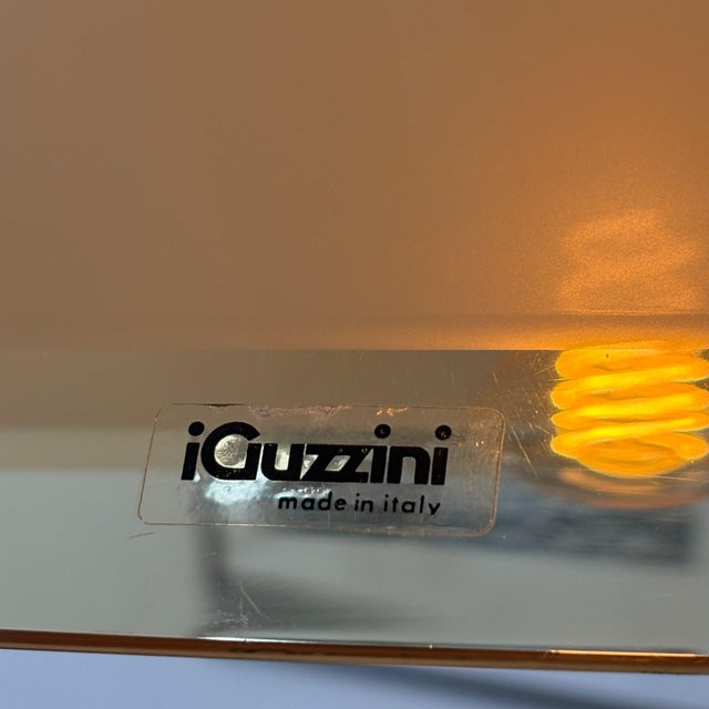 Italian pendant lamp designed by Franco Bresciani for Guzzini in the 1970s. The large amber-coloured acrylic shade is...