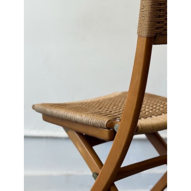 Add a touch of organic warmth to your space with this vintage Japanese folding chair. It beautifully balances mid-century...