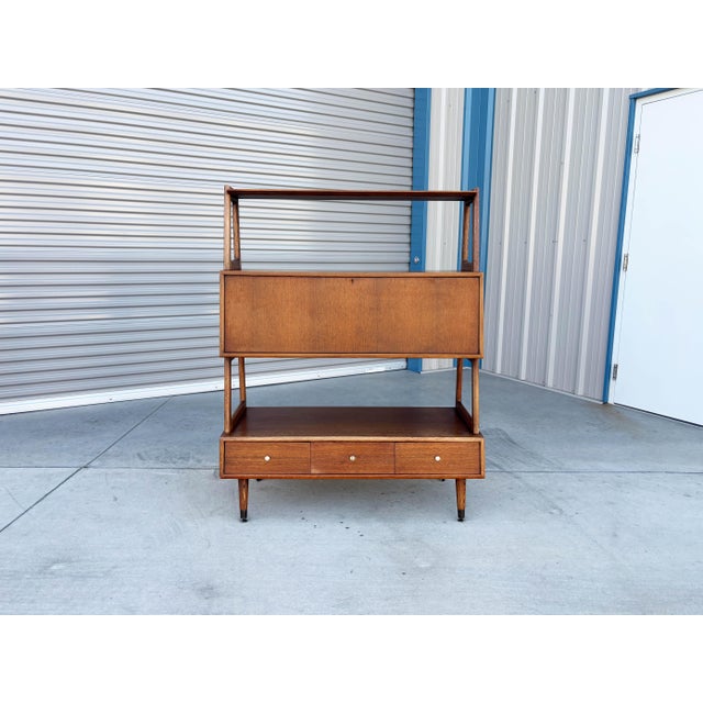 A rare and highly functional piece of American mid-century design, this multi-tier wall unit by Saginaw Furniture combines...