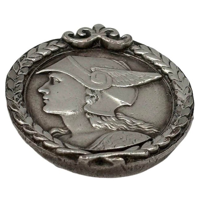 French Art Deco pewter medallion struck with the face of mercury pedant. The finely detailed design captures the regal...