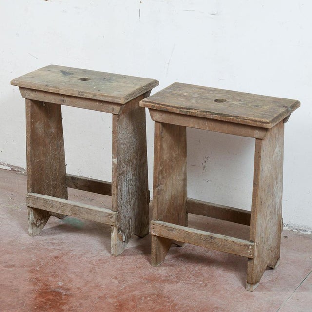 This pair of industrial-rustic style stools is a charming example of vintage furniture, ideal for collectors of mid-...
