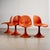 This bold set of four vintage chairs brings colour, character, and a strong silhouette to any setting. The curved seat...