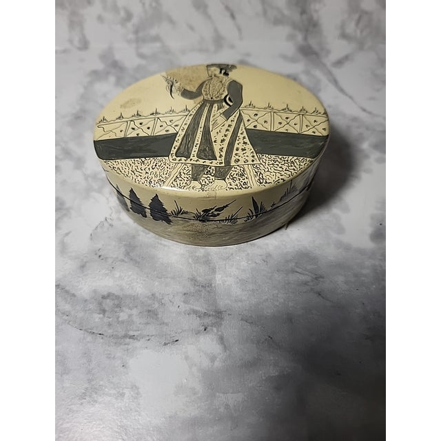 Handmade papier-mâché box from the Kashmir region of India. This box is adorned with a stylized image of a prince or...