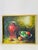 Post modern still life with red vase and apples oil on canvas painting. Gold tone frame.