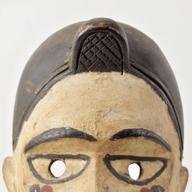 The Kongo people created ceremonial face masks, worn by ritual specialists or diviners known as Nganga Diphomba, that...