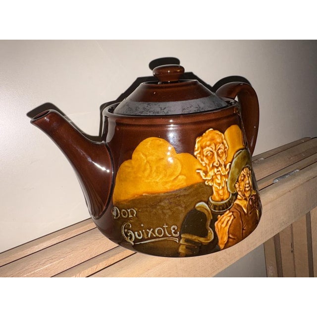 Royal Doulton Kingsware England ceramic teapot depicting Don Quixote and Sancho Panza 13 cm high, 21 cm wide and 14 cm deep