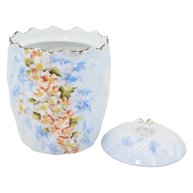 This stunning antique porcelain canister set features a beautifully sculpted design with hand-painted flowers, gold trim,...