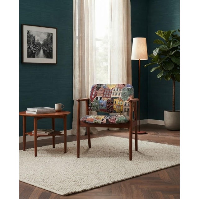 A magnificent and eye-catching matching pair of fully refurbished Hungarian Art Deco lounge armchairs, featuring rich...