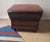 Vintage pouffe / ottoman in warm chestnut brown leather.