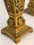Pair of late 19th-century gilt candle holders featuring intricate openwork casting and classical acanthus-leaf decoration....