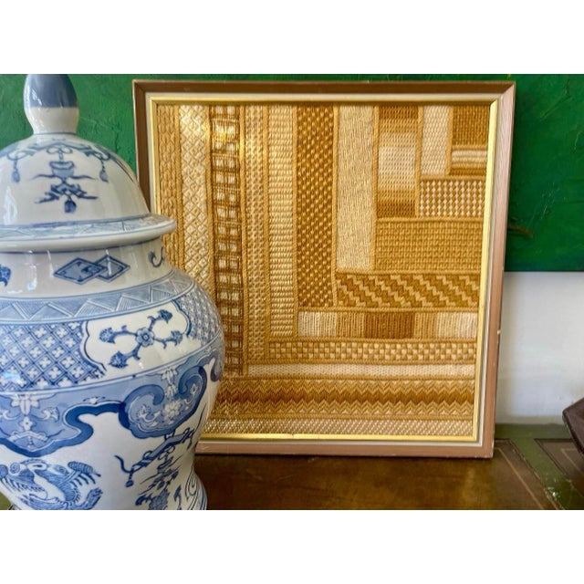 Bohemian, 1970s crewel artwork, presented in a patchwork design, the yarns are in a golden mustard, yellow and creamy...