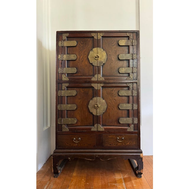 Diminutive early 19th century Korean Jang cabinet with brass detail features upper and lower cabinet and two small...