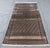 A vintage Baluch tribal rug in the collectible Mina Khani ("thousand flowers") design — an all-over rosette trellis of...