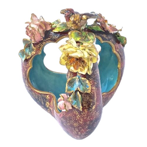 Antique French Edourd Gille Majolica bird and floral basket cachepot. Depicts a hand-painted three-dimensional bird atop...