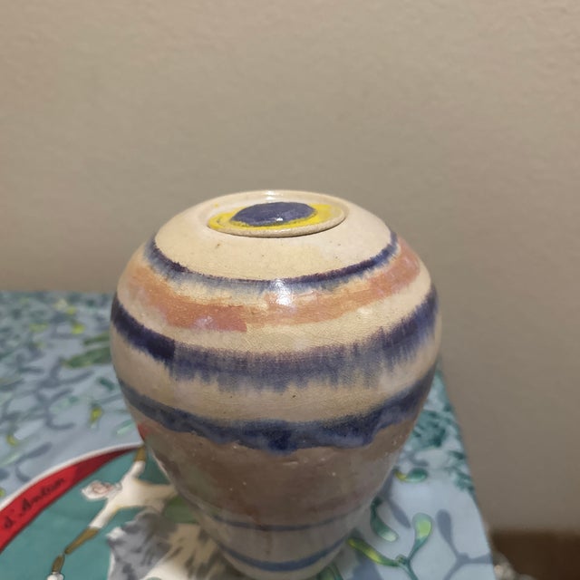 Elevate your space with this beautiful vintage studio art pottery vase. Crafted with an organic, hand-thrown shape, it...
