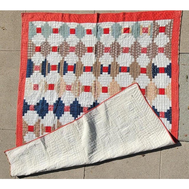 Early 20thc Log cabin quilt with a wonderful faded/muted color pallet. The variation in color change and color choice in...