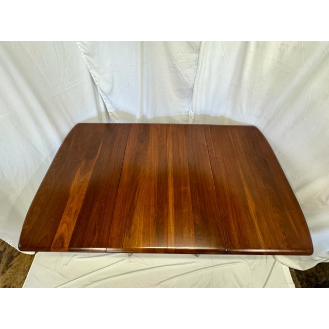 This solid walnut dining table is a true masterpiece in craftsmanship and beauty. The top is made of sold walnut planks...