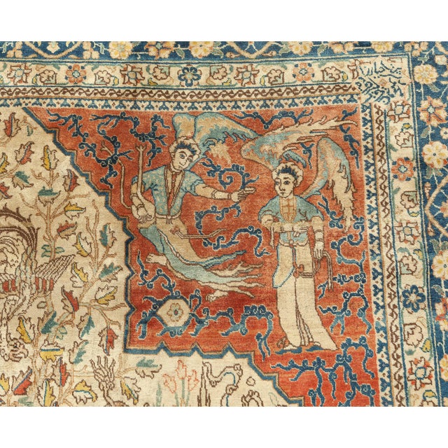 An early 20th century antique Persian Tabriz carpet, with a classical central medallion with dancing angels, birds and...