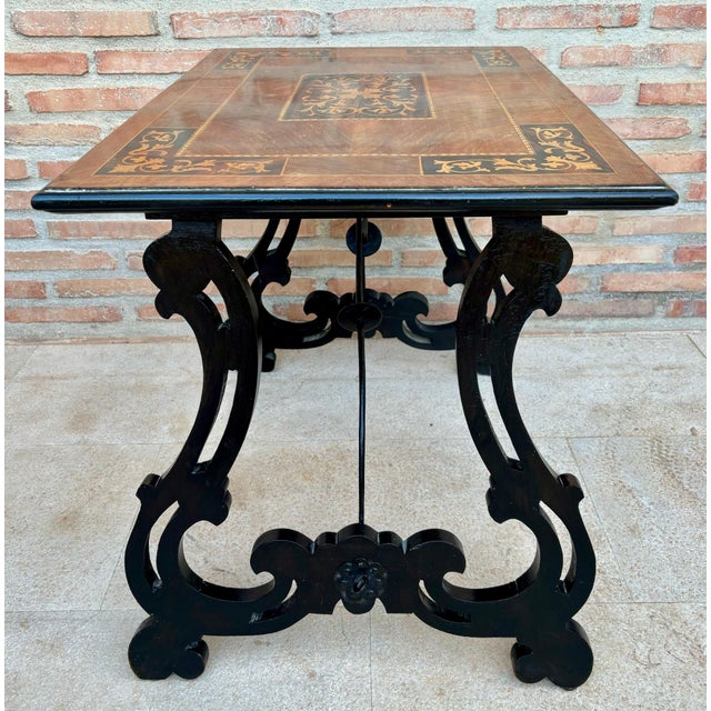 19th century Baroque Spanish side table with marquetry top 19th century Spanish trestle table in walnut. This piece has a...