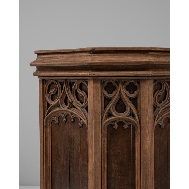 This 1928 French Gothic Revival wooden pulpit captures the dramatic architectural spirit of the style, blending...