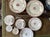 Gorgeous collection of 10 pieces of English fine china by Mintons. Presented on a crisp white, bouquets of blues, pink,...