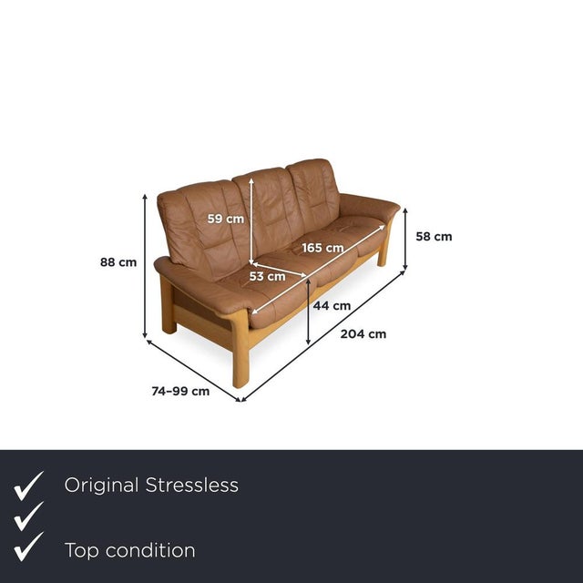 with the Stressless Windsor three-seater sofa, you get Norwegian seating comfort with a warm wooden frame. The cognac-...
