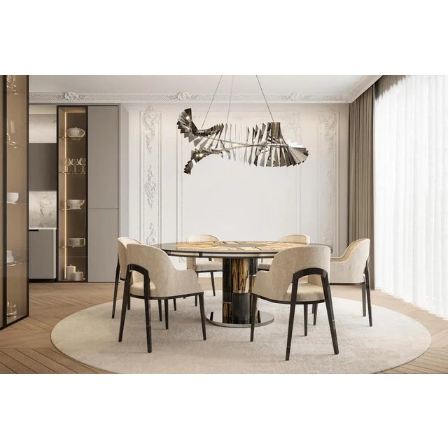 Royal ebony dining table by memoir essence dimensions: d 160 x w 160 x h 76 cm. Materials: polished brass, lacquer and...