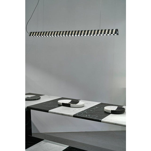 Alcm horizontal pendant lamp in verde alpi & carrara marbles by bufalini design dimensions: d 6 x w 120 x h 6 cm....