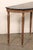 An Italian carved wood demi console, with original marble top, from the mid 20th century. This mid-century table from...