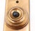 Vintage polished brass doorbell plate with a single black plastic button. The original mounting screws are not available....
