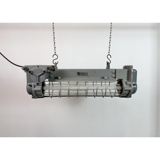 This industrial tube light was made by Elektrosvit in former Czechoslovakia during the 1970s. It is made of an aluminium...