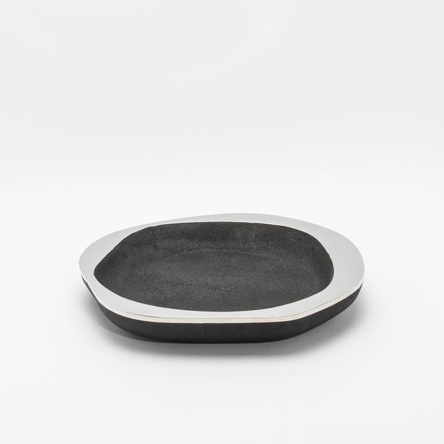 The Lily Bowl in black shagreen with polished stainless steel details by R&Y Augousti is a masterful blend of elegance and...