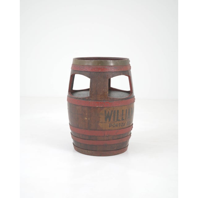 This early 20th-century Portuguese wooden barrel side table is a unique testament to the rich wine heritage of the Douro...