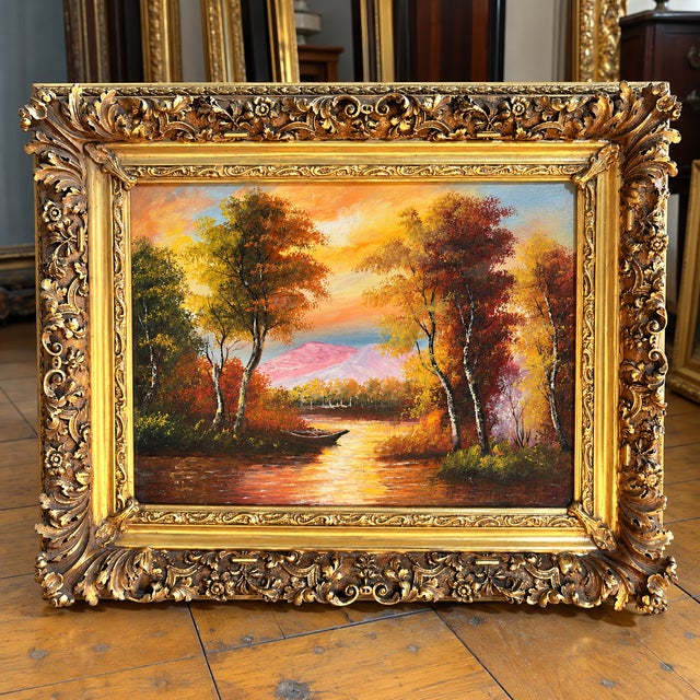 Bring warmth and timeless charm to your home with this captivating landscape artwork, depicting a tranquil lake reflecting...
