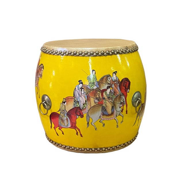 This is a handmade oriental ancient people riding horse accent graphic decorative table in a drum shape with yellow base...