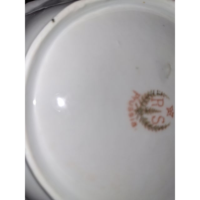 Authentic R.S. Prussia antique porcelain plates made by the Reinhold Schlegelmilch factory in Germany. The backstamp...