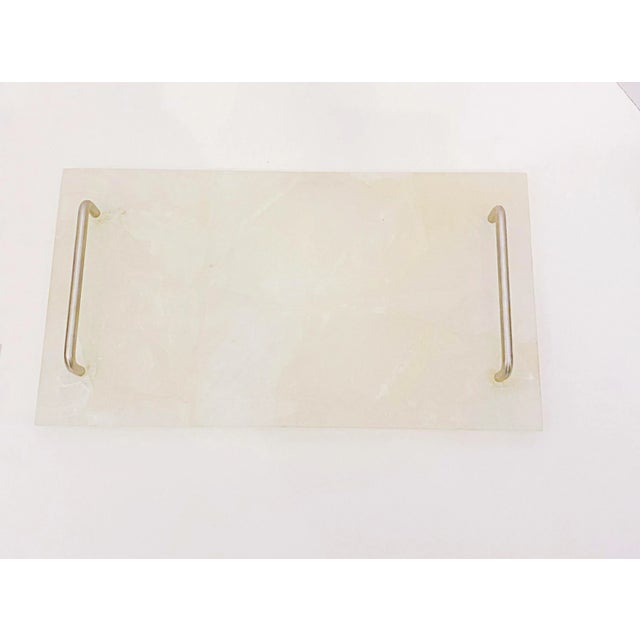 A Classic silhouette with a modern twist, this rectangular tray is fashioned of bold mixture of natural Natural and Smoke...