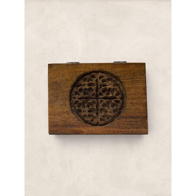 English handcrafted wooden jewelry box with Celtic knot carved across the lid stops you the moment you pick it up. There...