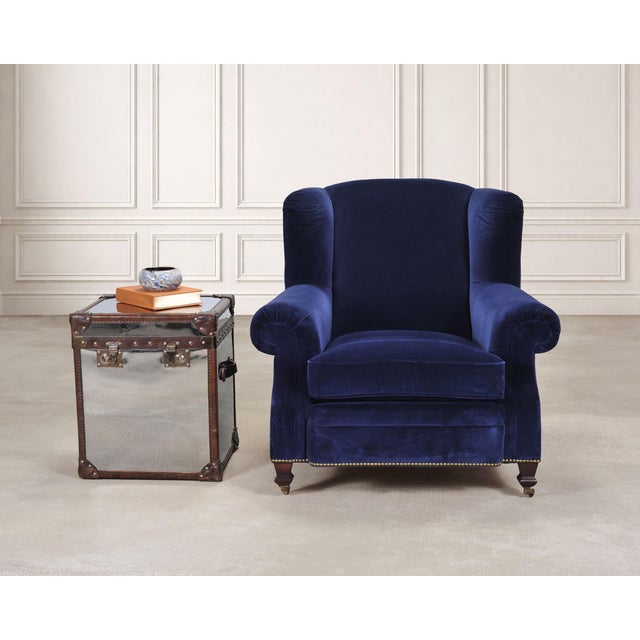 An elegant labeled English "New Bohemian Artist’s Chair", designed by Ralph Lauren. The large shelter wing chair is...