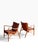 We are pleased to present a pair of iconic Finn Juhl 45 Chairs. These 2000s edition chairs are signed by House of Finn...