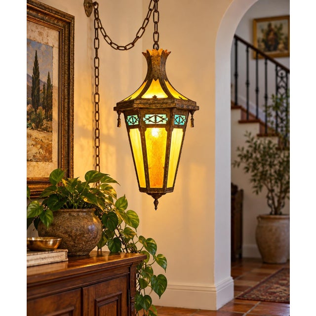 A dramatic vintage six-panel stained glass hanging swag lantern featuring an ornate Gothic and Mediterranean Revival-...