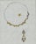 Original jewelry design sheet depicting a delicate floral necklace together with a coordinating pendant or earring study....