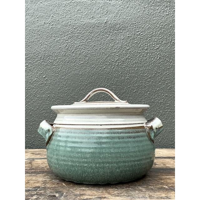This unique vintage studio pottery lidded bowl is a beautiful example of organic modernism and artisanal skill. Hand-...