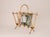 Rare Italian faux bamboo magazine rack from the 1970s, made from gilded Iron. The gently asymmetrical form appears to be...